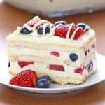 A picture of a slice of a layered, berry icebox cake.