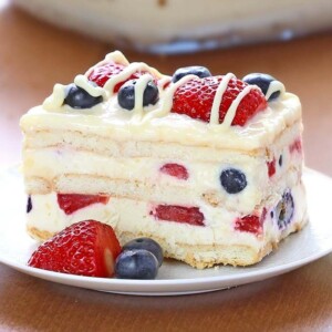 A picture of a slice of a layered, berry icebox cake.