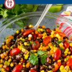 This black bean salad is a colorful and refreshing blend of beans, corn, peppers, herbs and avocado, all tossed in a zesty lime dressing.