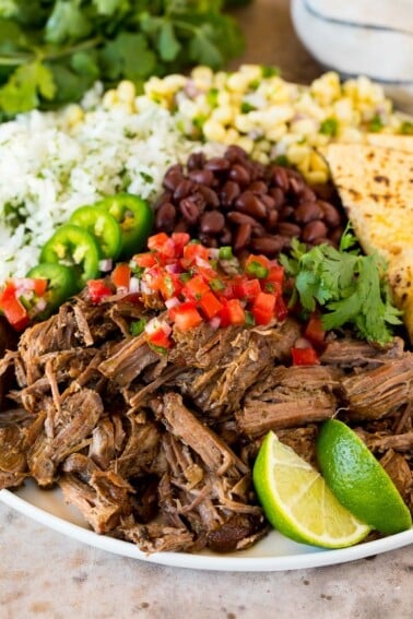 A platter of Chipotle barbacoa served with rice, beans and salsa.