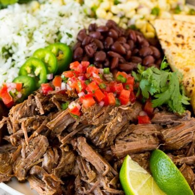 A platter of Chipotle barbacoa served with rice, beans and salsa.