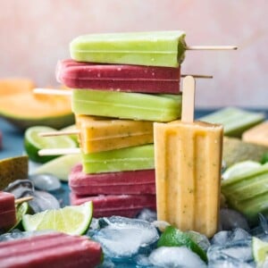 A stack of melon flavored popsicles in three colors.