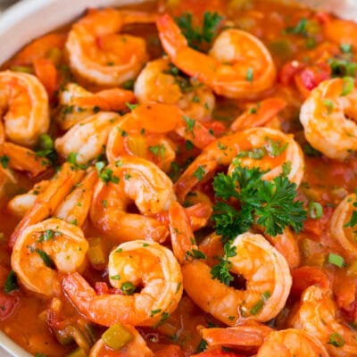 A pan of Shrimp Creole garnished with parsley.