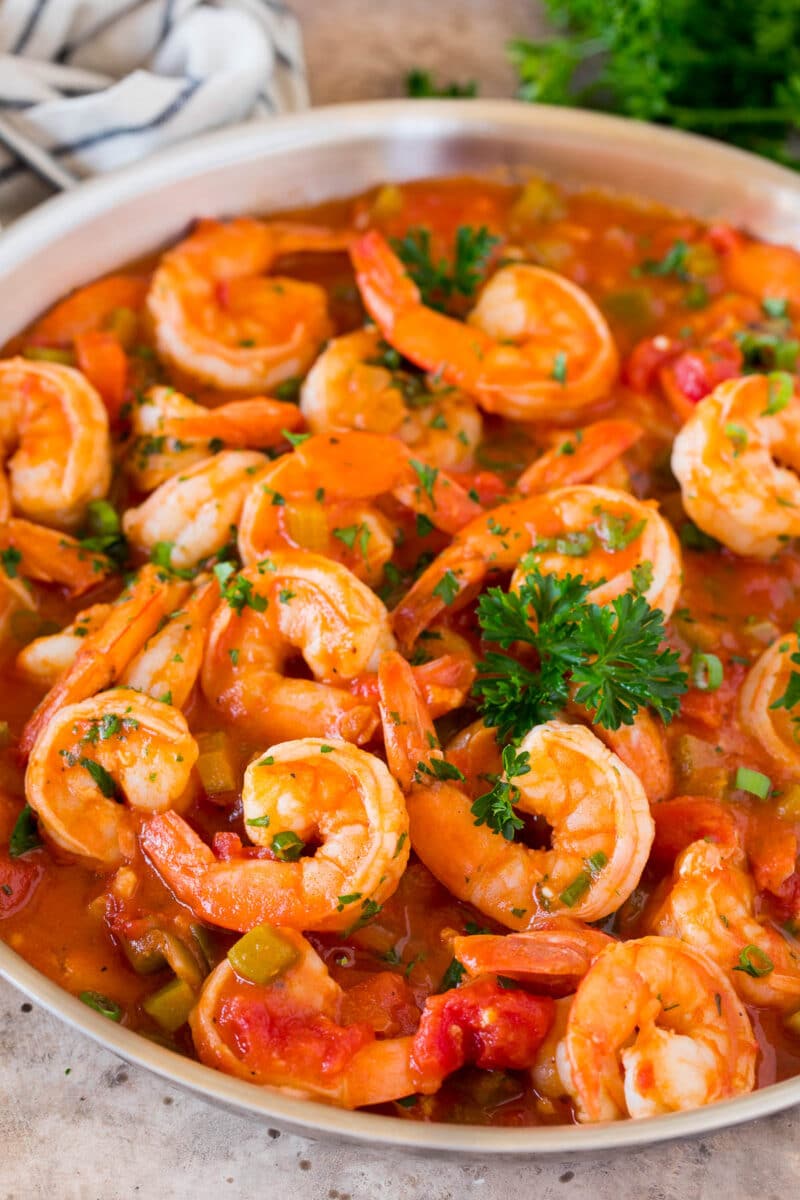 A pan of Shrimp Creole garnished with parsley.