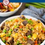 This beef fried rice is cubes of marinated steak cooked with eggs, vegetables and rice in a savory sauce.