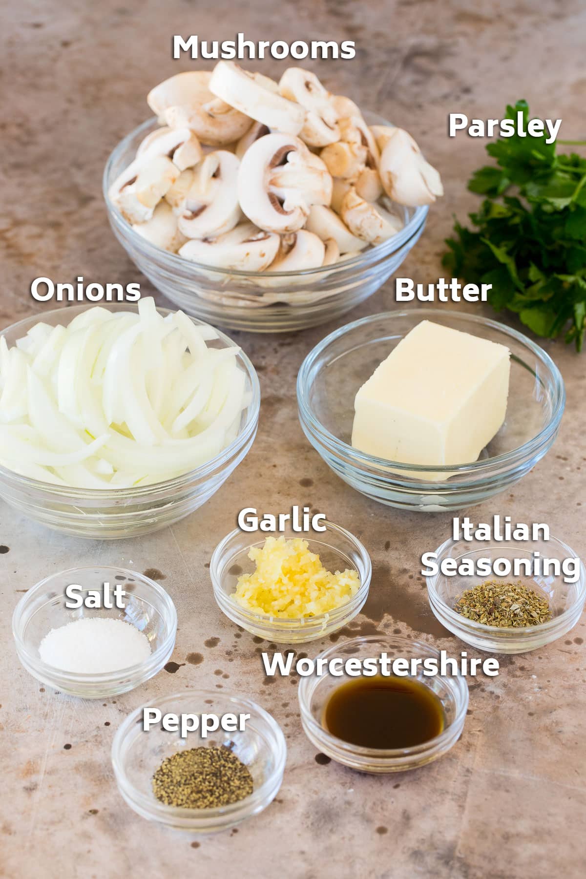 Bowls of mushrooms, onions, butter and seasonings.