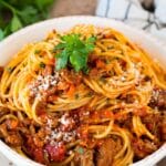 Slow cooker bolognese sauce served with spaghetti.
