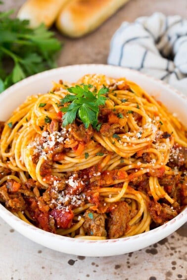 Slow cooker bolognese sauce served with spaghetti.