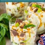 This snicker apple salad is fresh apples and chopped candy bars in a sweet and creamy dressing.