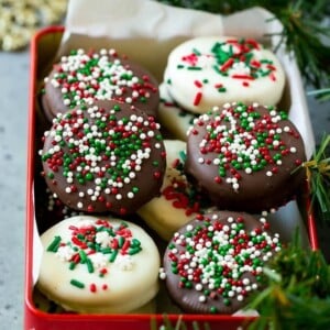 An image of chocolate covered Oreo cookies in a red gift box.