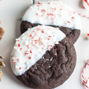 An image of two dark chocolate candy cane cookies cookies.