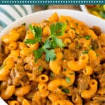 This homemade hamburger helper is seasoned ground beef, noodles and cheese, all cooked together in a creamy tomato sauce.