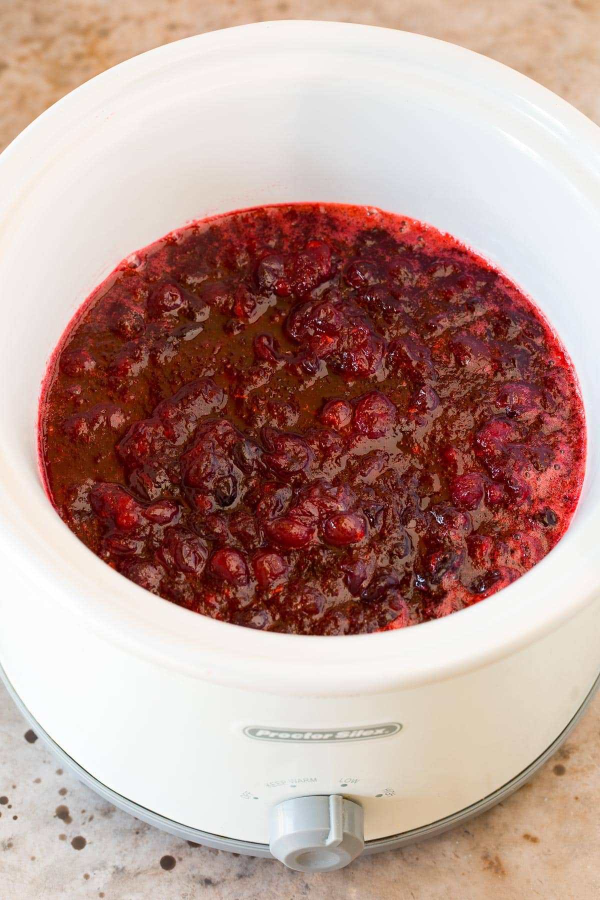 Cranberry sauce inside a crock pot.