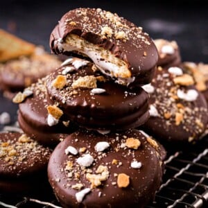 A picture of a pile of Ritz Smores Cookies on a wire cooling rack.