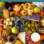 This Thanksgiving charcuterie board is a display of meats, cheeses, nuts, crackers, fall fruit and seasonal treats.