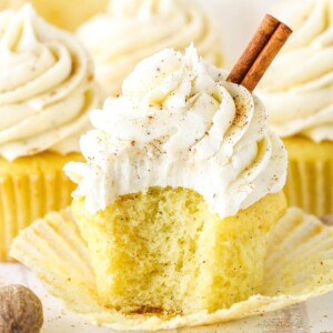 An image of an eggnog cupcake with the wrapper open.