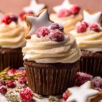 An image of a gingerbread cupcake with a star shaped gingerbread cookie on top.