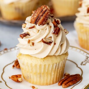 An image of a pecan pie flavored cupcake on a plate.