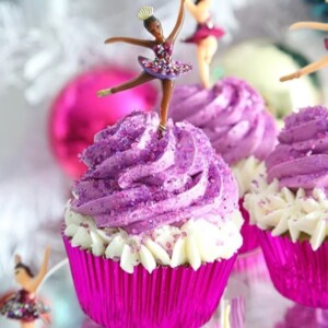 An image of a sugar plum fairy cupcake with purple frosting.
