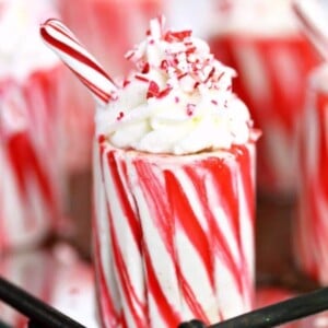 An image of a candy cane cup with whipped cream on it.