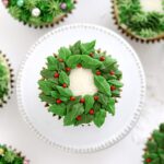An overhead image of a Christmas wreath cupcake.