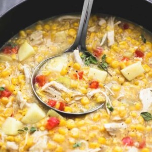 An image of a ladle in a pot of turkey corn chowder.