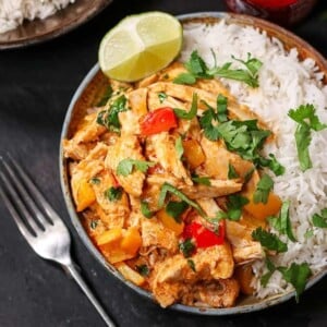 An image of a turkey curry in a bowl with rice.