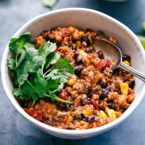An image of crockpot quinoa chili with cilantro on top.
