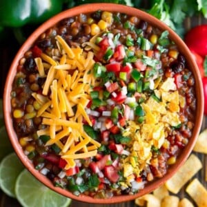 An image of lentil taco chili in a bowl with cheese on top.