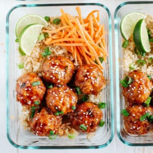An image of sriracha meatballs with carrots.