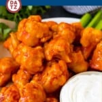 This recipe for buffalo cauliflower bites is crispy cauliflower florets baked to perfection and coated in spicy buffalo sauce.