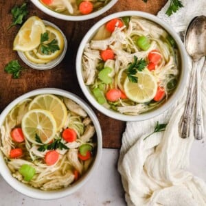 An image of two bowls of chicken soup with zoodles.