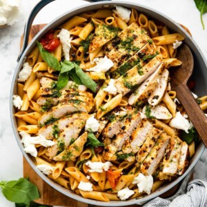 An image of tomato basil chicken pasta in a pan.