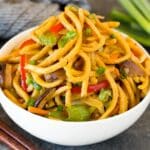 A serving bowl filled with vegetable lo mein.
