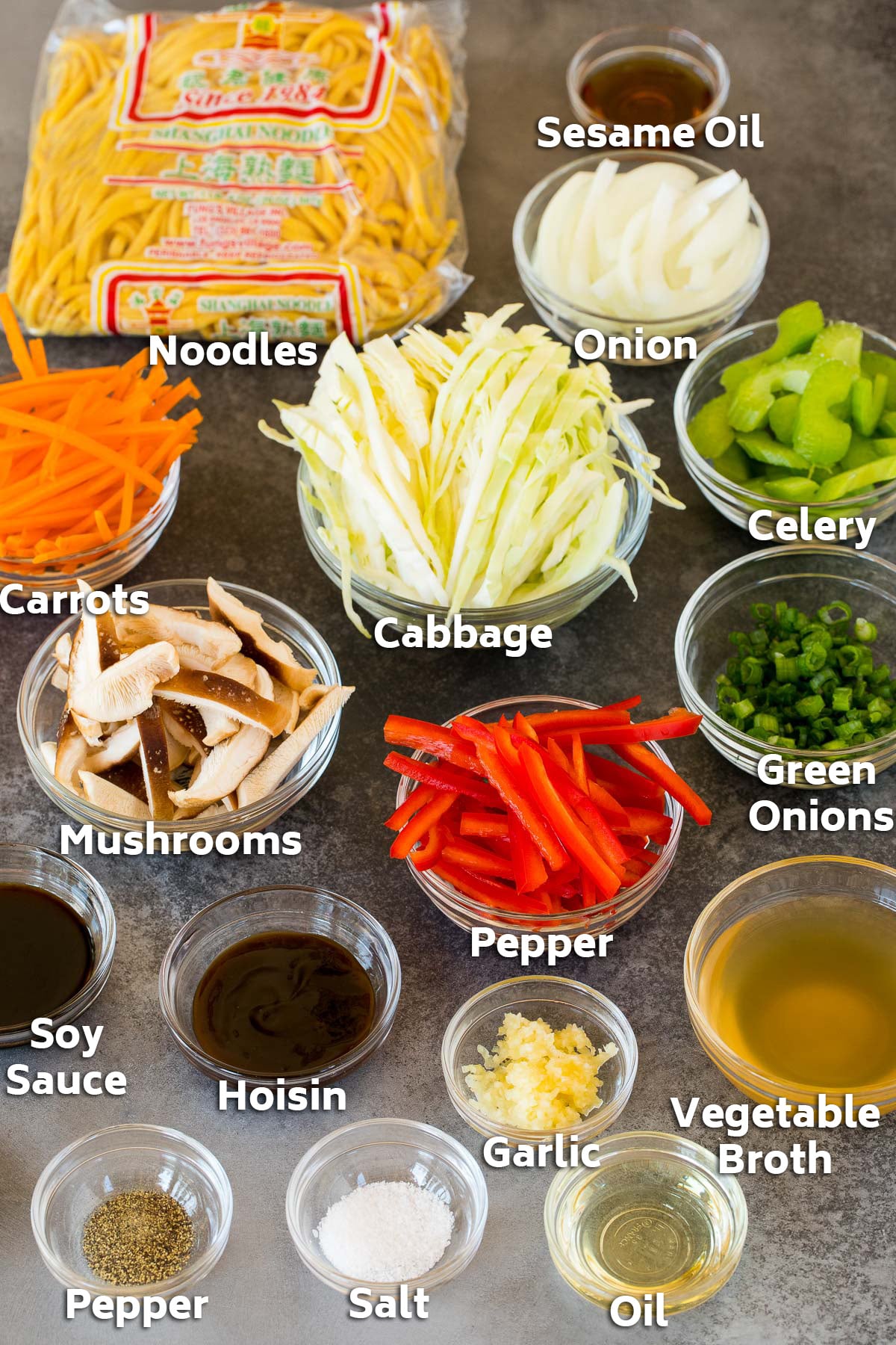 Bowls of ingredients including chopped vegetables and seasonings.