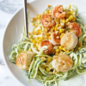 A picture of a bowl of Chili Lime Shrimp and Scallops with Zucchini Noodles.