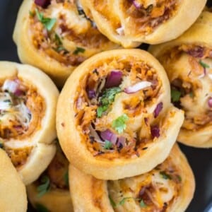 An image of barbecue chicken pizza rolls in a stack.