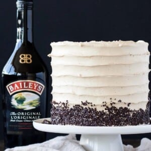 An image of a coffee Bailey's layer cake on a cake stand.