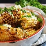 An image of a bowl of spicy ancho grilled corn on the cob.