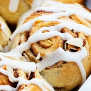 An image of almond cinnamon buns with frosting.
