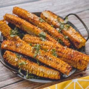 An image of several corn ribs on a platter.
