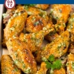 These garlic parmesan wings are crispy golden brown chicken wings coated in garlic, butter, herbs and cheese.