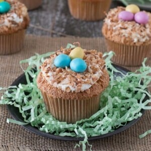 An image of a birds nest cupcake on a small plate.