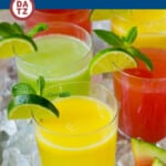 A picture of several glasses of agua fresca on a tray with ice.