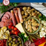 This antipasto platter is a combination of Italian meats, cheeses, vegetables and breads, all arranged to create a fabulous appetizer display.