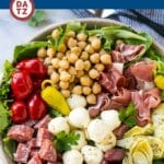 Antipasto salad that is loaded with Italian meats, cheese and veggies, all tossed in a homemade zesty dressing.