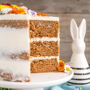 An image of a carrot cake with a slice removed.