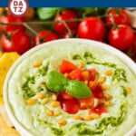An image of pesto dip that is a blend of mayonnaise, sour cream, basil pesto and seasonings.
