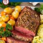 This Instant Pot corned beef is pressure cooked until tender, then served with potatoes, cabbage and carrots in a garlic butter sauce.