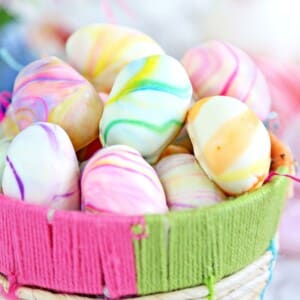 A picture of marbled Easter egg truffles in a basket.